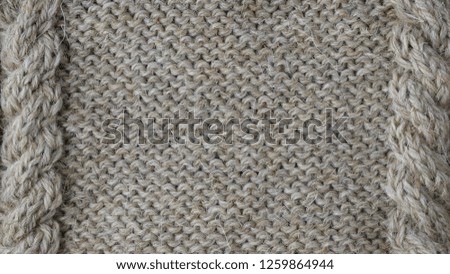 Natural coarse wool yarn. Hand knitted texture. Rustic background. Closeup