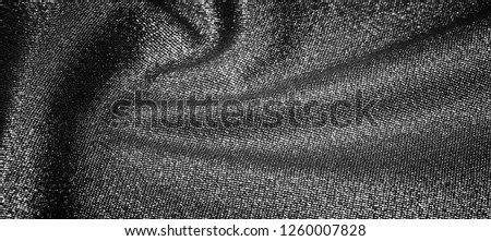 Texture, background, pattern. Cloth Gray black coated with a metallic silver thread. These fabrics are ideal for any project, wallpaper, all design solutions. and many uses of ships.