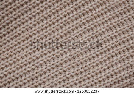brown texture of a woven piece of cloth made of a sweater
