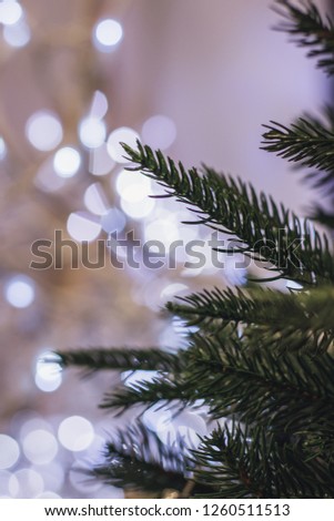 Christmas tree background and Christmas decorations, blurred, sparkling, glowing. Happy New Year and Christmas theme