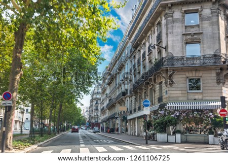 Luxury buildings and green trees in Paris, France