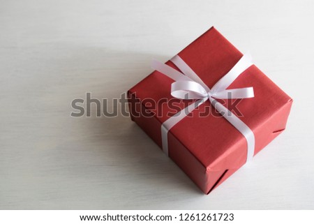 Gift box on white table