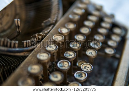 Close up view on an old dirty broken antique typewriter machine keys with Cyrillic symbols letters.