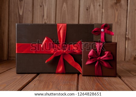 gift on wooden table. Photo in old color image style.