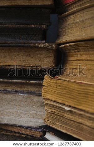 collection of images of ancient books in various compositions that recall an ancient atmosphere