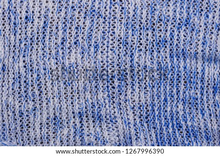 Blue knitting texture. Knitted cloth background