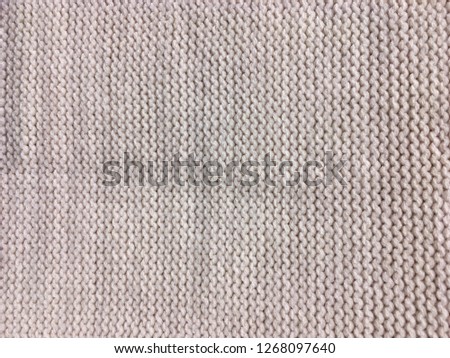 Cloth knitted wool background. Fabric knitting wool texture
