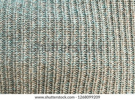 Knitted detailed wool wrap blanket. Texture of knitted wool cloth.
