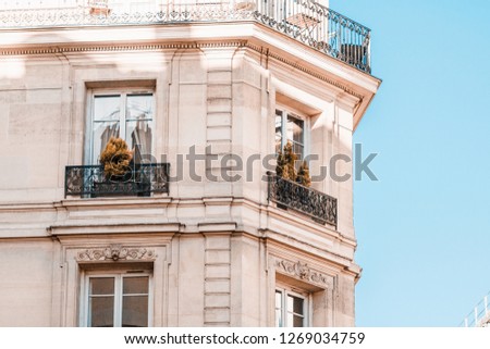 View from below on a facade European building with balconies in Paris, France.