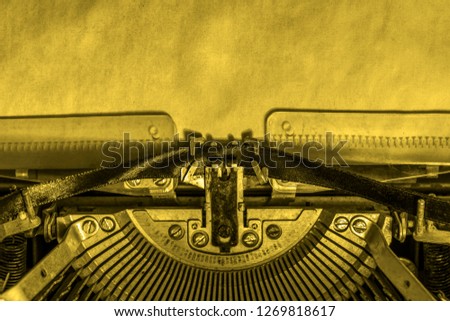 a blank sheet of paper inserted into a retro typewriter. writer, journalist.