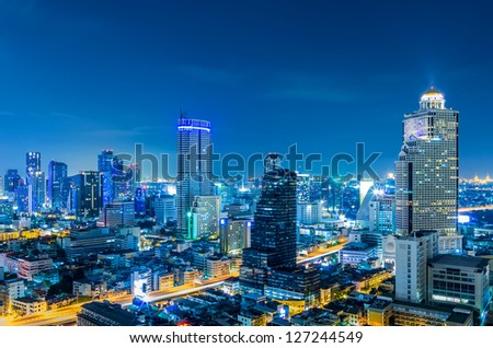 Landscape Bangkok city Modern building at twilight, high angle.