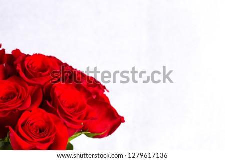 A Close Up View of a Bouquet of Red Roses