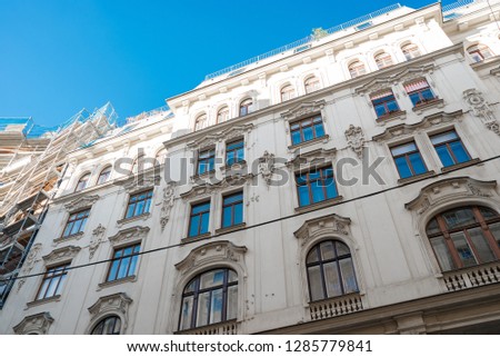 
The facade of the old bright beautiful building in clear weather in Europe. Vein