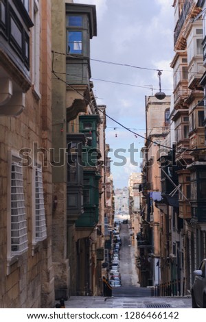 Narrow streets of Valetta with traditional balconies. Malta
