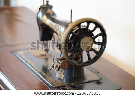 Old nostalgic sewing machine of the room
                               