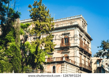 Travel to Italy -  historical street of Catania, Sicily, facade of old buildings