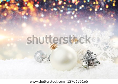 Silver shiny christmas balls in snow isolated on white background. Banner
