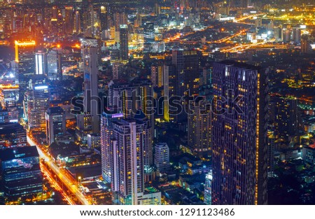 scenic of lighting up of cityscape in metropolis at night time