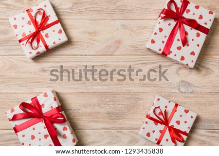 Frame of many Colorful gift boxes with red bow and heart blank copy space top view, Valentine or other holidays celebrations concept.