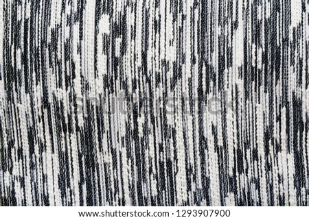 The texture of the knitted gray fabric for the background   