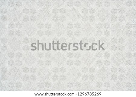 White wall or gray paper texture with leaves pattern,abstract cement surface background,ideas graphic design for web or banner 