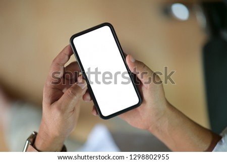 Closeup of male hands holding blank screen mobile smart phone