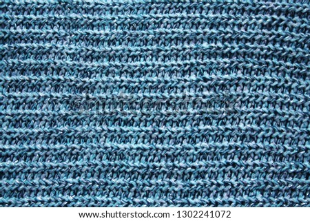 Blue knitted texture as background