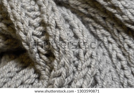 Macro photo of fabric pattern, close up of textile clothing with shallow depth of field. Soft blurred material background