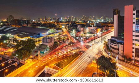 Modern city night background, The light trails on the modern building in Bangkok thailand