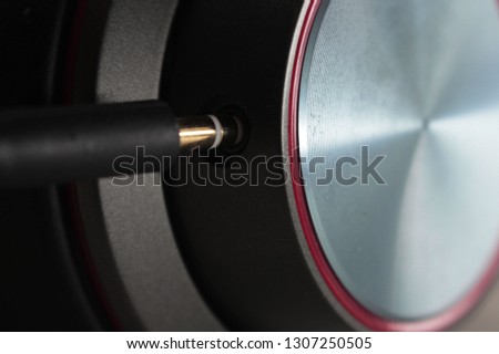 Input of the 3.5 mm yellow jack socket into the headphones. Macro shot