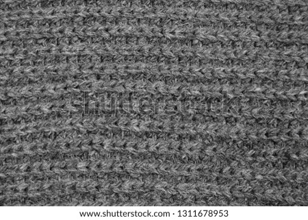 texture of a gray knitted  woolen cloth