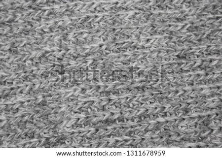 texture of a gray knitted  woolen cloth