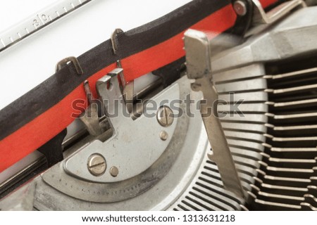 Typewriter with paper sheet