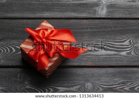 St. Valentine's day gift for a woman on wooden background