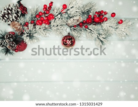 christmas background and decoration with fir branches snow on  wooden board 