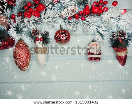 christmas background and decoration with fir branches snow on wooden board 