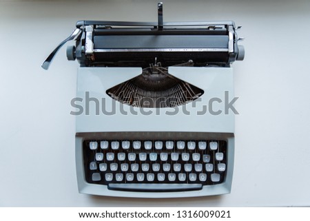 Old typewriter on white background