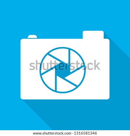 White camera icon in flat design. Vector illustration. Camera icon with long shadow on blue background.
