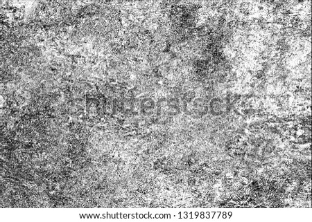 Grunge is black and white. The texture of paint strokes with a dry brush. Monochrome abstract grunge background. Pattern of cracks, chips, scuffs. Old vintage surface