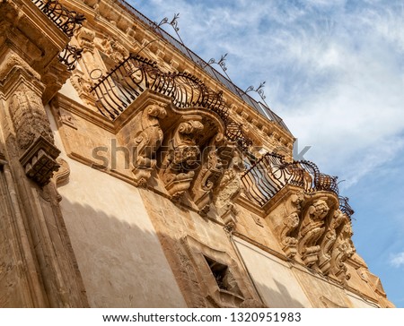 Italy, Sicily, Scicli (Ragusa province), the Baroque Beneventano Palace facade, ornamental statues under the balconies