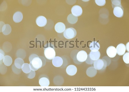 Blurred view of shiny silver lights. Bokeh effect