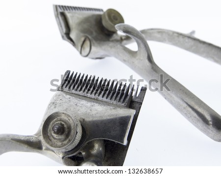 A old scissors - cutting blade, Hairdressing tool, old Hair Clipper, close-up of scissors on white background