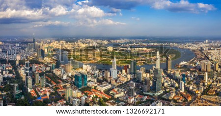 Top view aerial of Ho Chi Minh City with development buildings, transportation, energy power infrastructure. Financial and business centers in developed Vietnam. View from district 3 to district 1
