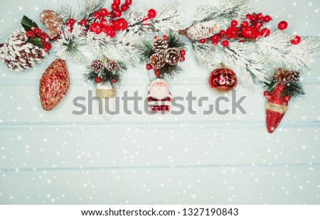 christmas background and decoration with fir branches on wooden board 