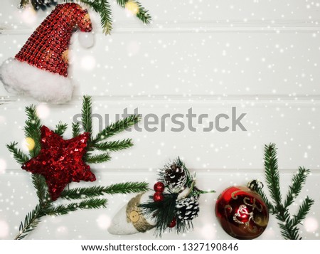 christmas background and decoration with fir branches garland lights on wooden board 