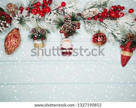 christmas background and decoration with fir branches on old wooden board 
