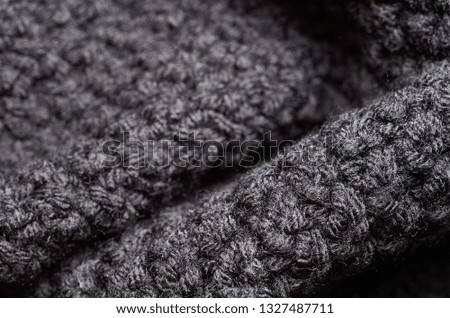 Macro photo of fabric pattern, close up of textile clothing with shallow depth of field. Soft blurred material background