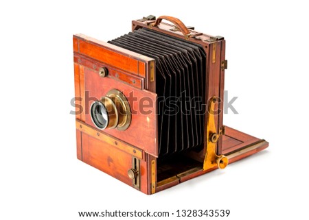 Vintage photo-camera isolated on white background.