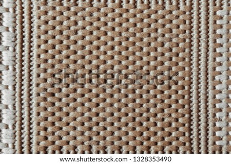 Close-up macro of beige fabric texture