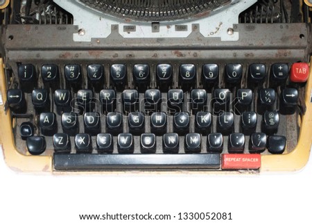 Keyboard of an old yellow vintage typewriter 